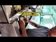 Macchina avvolgitrice per rivestimento di carta di tipo portafoglio per guanti chirurgici intelligenti